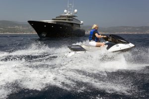 Boat Surfing in blue sea
